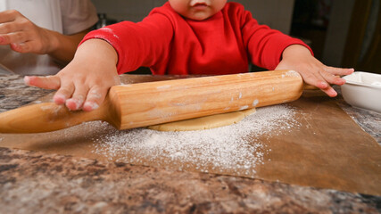 Portrait of a child with a rolling pin