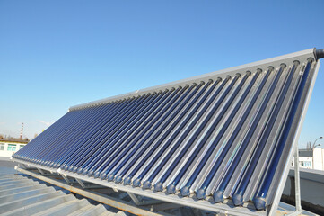 A close-up of an evacuated tube solar thermal hot water system, solar thermal panel collector...