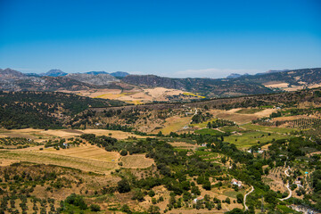 Fototapeta na wymiar Panorama of the valley near the city of Ronda on a bright Sunny day