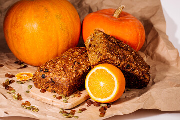 Pumpkin bread loaf sitting on wooden cutting board 