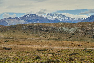 vast open landscape in Patagonia with snow covered mountains of the Andes in the background