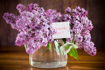 bouquet of beautiful spring flowers of lilac on the table