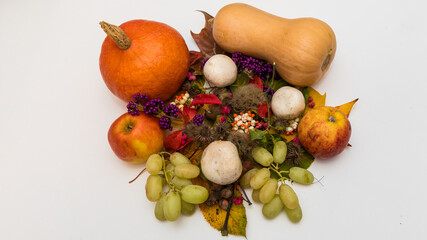 Home made autumnal composition with fruits and branches