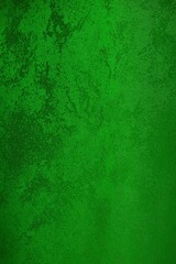 Fototapeta na wymiar Vertical abstract dark green fabric background