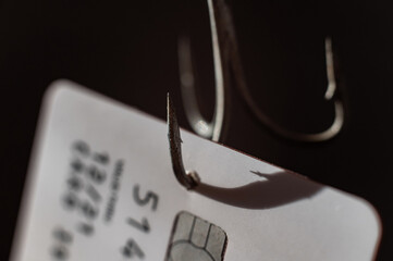Close-up of a credit card on a fishing hook