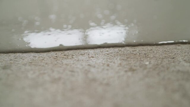 The process of pouring self-filling floors close-up. Concrete floor. on it departure fluid to align the horizon. close-up.