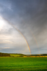 An Early Autumn Rainbow in a dramatic sky landscape