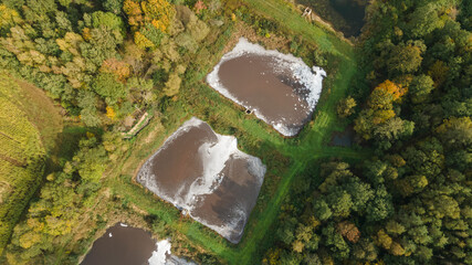 Aerial view of urban sewage filtration ponds system. Sewage farm. Ecology concept.
