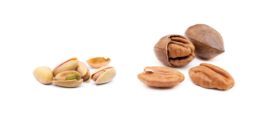 Pile of roasted pistachios and pecan isolated on white background