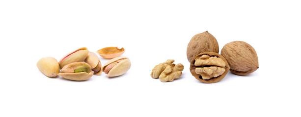 Pile of roasted pistachios and walnuts isolated on white background