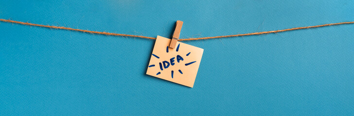 Motivational and inspirational quotes -"IDEA".  Text on hanging paper note.