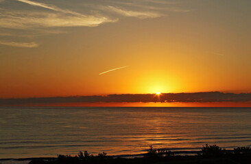 Yellow and red sunrise on the beach, sea landscape