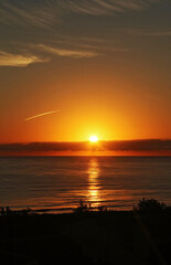 Yellow and red sunrise on the beach, sea landscape