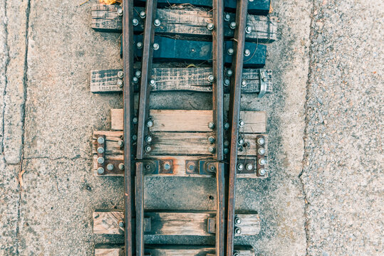 Detail Of The Old Sleepers That Hold The Rails Of A Small Train Track.