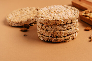 Various types of healthy whole grain crispbreads and cookies on a brown cozy background on a wooden Board.