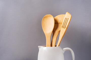 Harmonious background, the concept of the cozy kitchen. Kitchen utensils on a uniform background