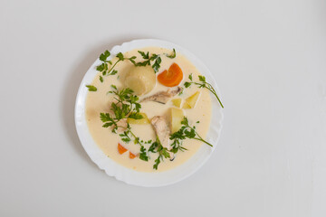 Salmon fish soup. Culinary background with selective focus