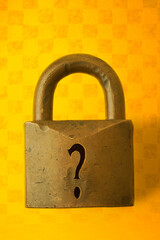 A heavy brass lock with a question mark for the keyhole