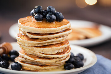 Pancakes with blueberries and syrup for Christmas morning breakfast