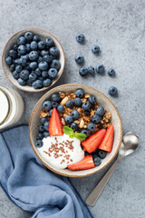 Granola bowl with berries, greek yogurt and flax seeds. Top view. Healthy food