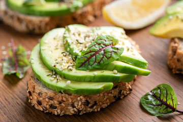 Vegan avocado toast with hemp seeds and swiss chard micro green leaf
