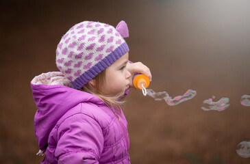  Girl, garden, lilac coat, soap bubble blower