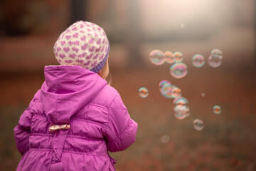  Girl, garden, lilac coat, soap bubble blower