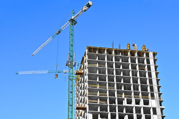 Crane and highrise construction site