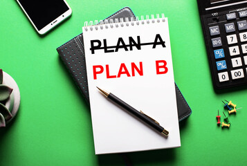 On a green background there is a phone, a calculator and a diary with the word PLAN B.