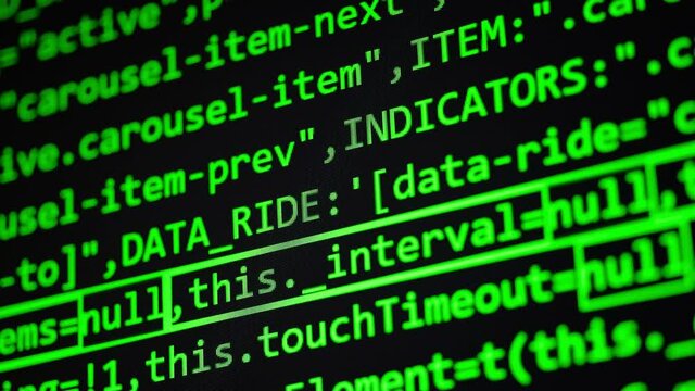 Code. Green javascript computer programming code texture close up pixel detail shot 4K super macro on screen.