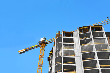 Crane and highrise construction site