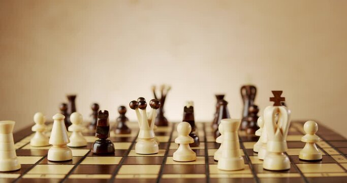 rotating old wooden chess pieces on a chessboard