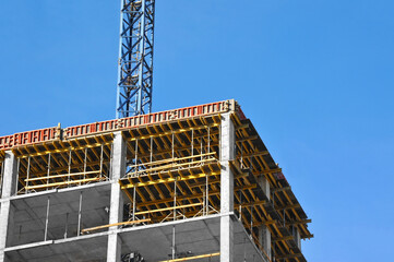 Crane and highrise construction site