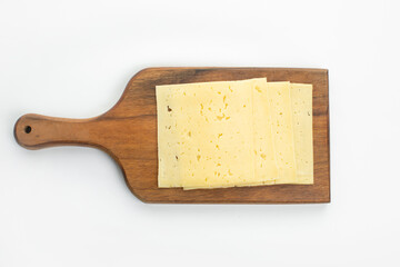 Sliced cheese on wooden desk