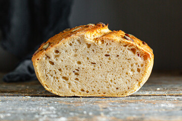 whole grain bread with pumpkin and sunflower seeds rye sourdough loaf gray dough organic portion on the table serving healthy meal snack ingredient top view copy spacefor text food background rustic
