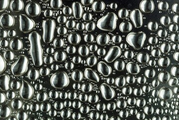 A abtract of a water droplets bubbles stlye on a glass edges.