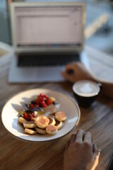 Breakfast near labtop with coffe