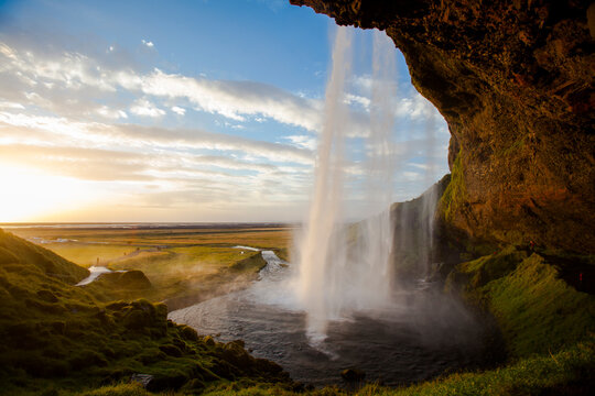 Scenic view of Seljalandsfoss waterfall during sunset