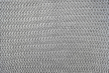 Brown woolen knitted background, fabric texture close up