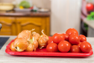Onions and tomatoes. Culinary background with selective focus