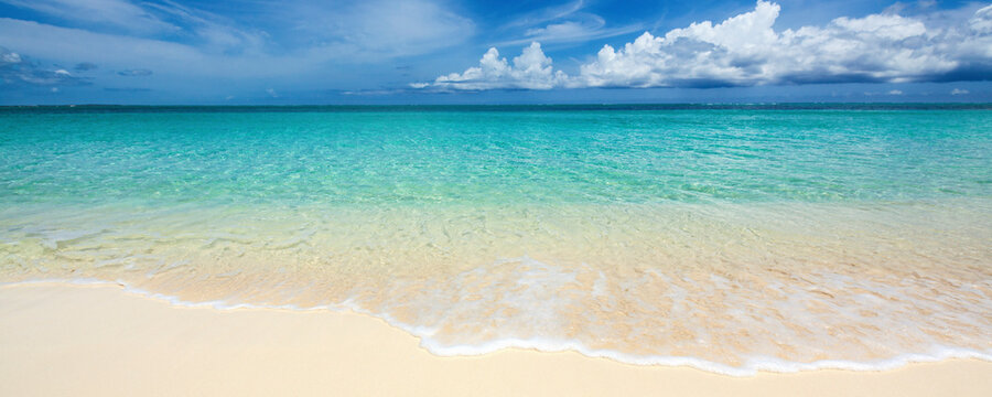Scenic view of beach against cloudy sky - Powered by Adobe