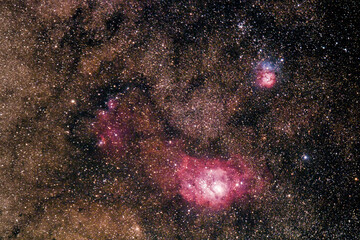 View of Lagoon Nebula resting below Trifid Nebula in Sagittarius constellation
