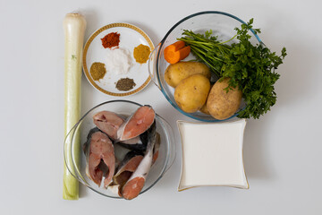 Vegetables and salmon for fish soup. Culinary background with selective focus