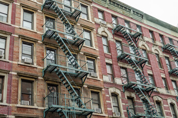 Typical Manhattan Apartments with Fire Escape Ladders in New York City, USA