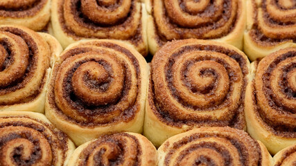 Obraz na płótnie Canvas Freshly baked cinnamon buns close up