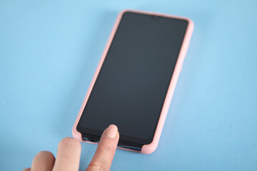 woman touching phone screen