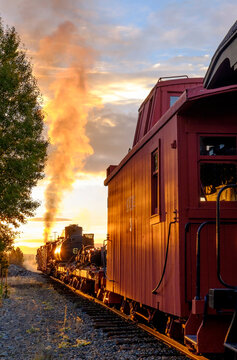 Old steam train moving on railroad track