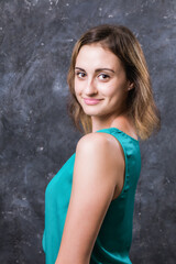 Fototapeta premium Pretty young woman dressed in green shirt