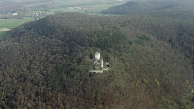 The fairytale castle burg Plesse in Bovenden near G&ouml;ttingen Goettingen at sunrise, Lower Saxony, Germany. Drone aerial shot of the Plesseburg in late autumn.