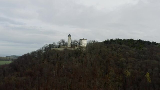 The fairytale castle burg Plesse in Bovenden near G&ouml;ttingen Goettingen at sunrise, Lower Saxony, Germany. Drone aerial shot of the Plesseburg in late autumn.